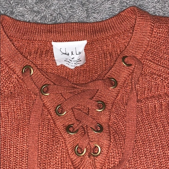 A knitted drawstring sweater. - Picture 2 of 3